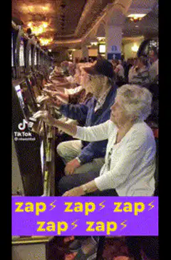 Elderly people playing slot machines in sync