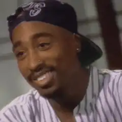 Tupac Shakur laughing and sticking tongue out