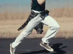 K-pop idol running in a field