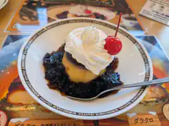 Pudding with whipped cream and cherry