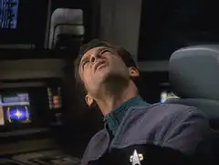 Jean-Luc Picard leans back in his chair