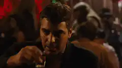 Javier Bardem drinking beer in a bar