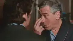 man picking nose in close-up