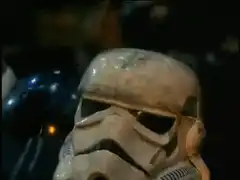 Stormtroopers and C-3PO around a campfire