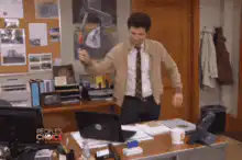 Michael Scott hits laptop with hammer