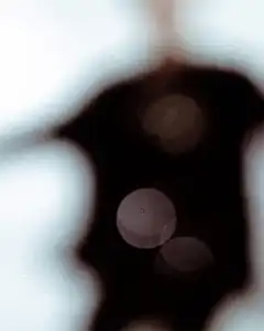 blurred bokeh lights on dark silhouette