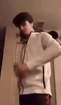 Person in white hoodie dancing