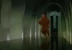 The Cowardly Lion running away