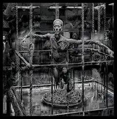 creepy collage of faces in cage