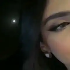 Woman winking in the dark