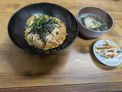 Japanese meal with omelet rice and miso soup
