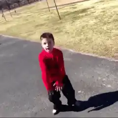 kid in red sweater dancing