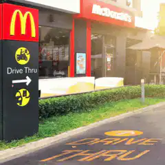 Woman on scooter at McDonald's drive thru