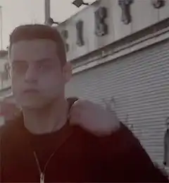 Rami Malek puts on a hood
