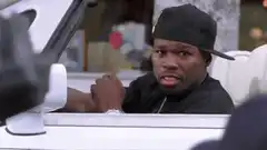 50 Cent in a car looking confused then smiling
