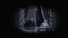 Charlie Chaplin on balcony