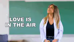 Woman looking up with text Love is in the air
