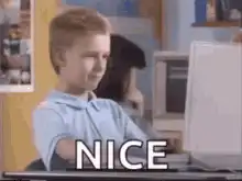 Boy looking at computer screen says nice