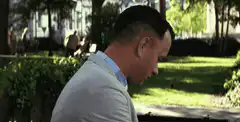 Forrest Gump holds a sign