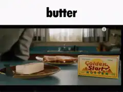 Man eating butter from plate