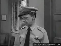 Officer Barney Fife shows off his gun