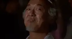 Old man smirking and nodding