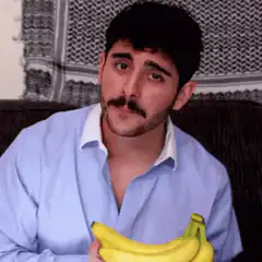 Man holding bananas saying hello
