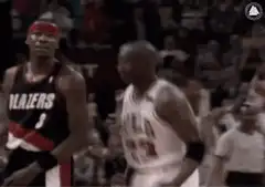 Michael Jordan shrugging at LaMarcus Aldridge