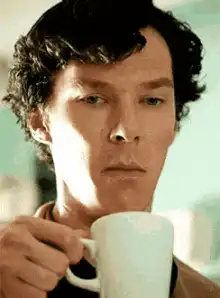 Sherlock Holmes sipping tea