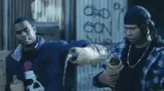 Two men pour beer on a third man's face