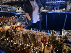 bartender pouring drinks at bar