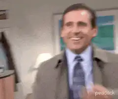 Michael Scott laughing and covering mouth