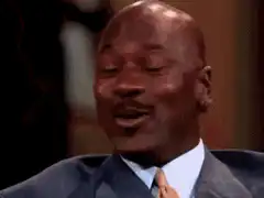 Michael Jordan laughing and covering his mouth