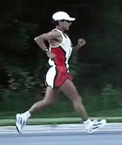 Man in red and white running