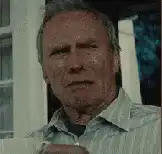 Clint Eastwood squinting and looking away