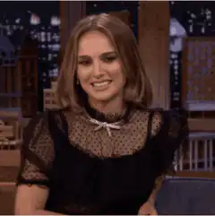 Natalie Portman smiling and looking around