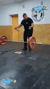 Man jumps over spinning barbell