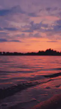 Pink and purple sunset over water