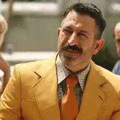 Man in yellow suit laser eyes