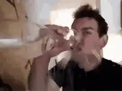 Man spilling water while drinking