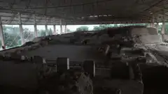Pan across ancient ruins under shelter
