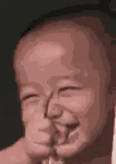 Baby laughing with eyes closed