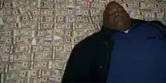 Biggie Smalls lying in money