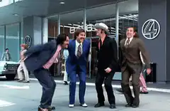 Four men jumping in celebration