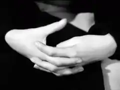Hands clasping and unclasping