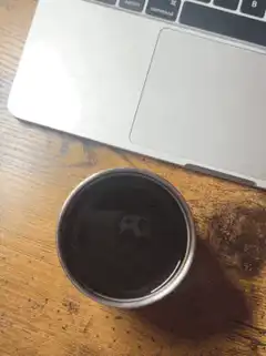 Coffee cup with laptop