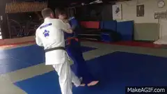Judo throw on blue mat