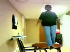 woman falls off chair