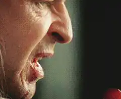Man eats cherry tomato