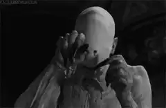Creature with eyes on hands